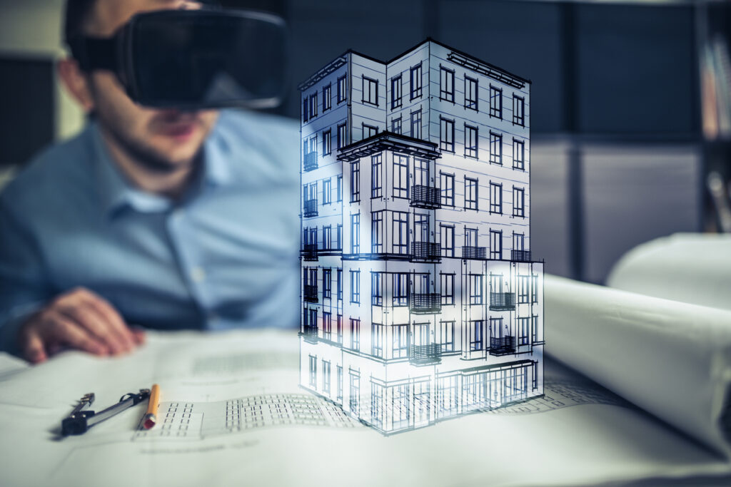 Foto von animiertem Bauprojekt und Person mit VR-Brille im Hintergrund (copyright Getty Images)